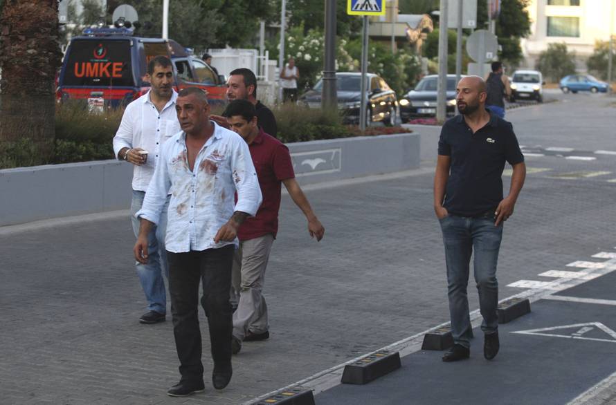 Plain clothes policemen are seen on a street in the resort town of Marmaris