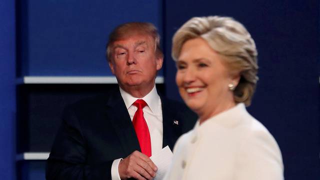 Republican U.S. presidential nominee Donald Trump and Democratic U.S. presidential nominee Hillary Clinton finish their third and final 2016 presidential campaign debate at UNLV in Las Vegas