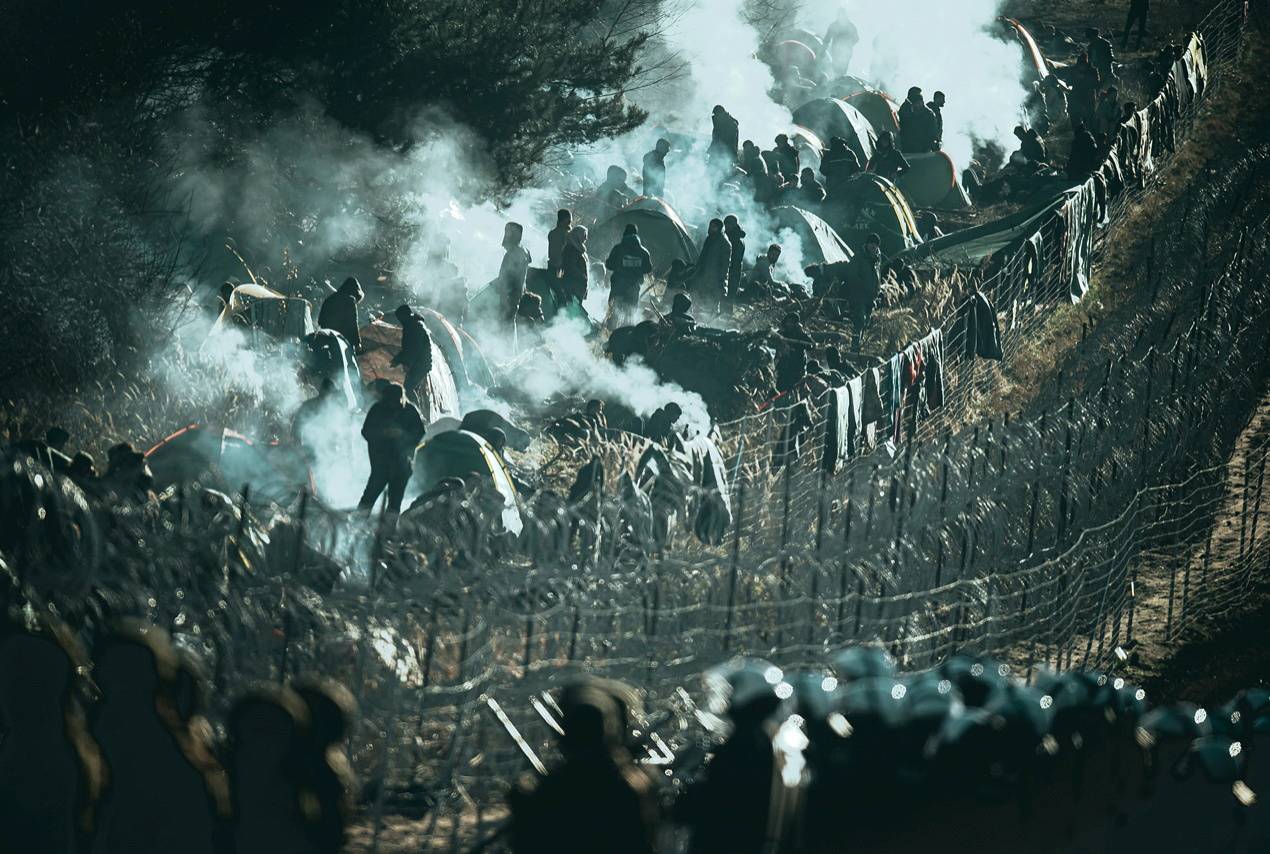 Hundreds of migrants camp at the Belarus side of the border with Poland near Kuznica Bialostocka, Poland, in this photograph released by the Polish Defence Ministry