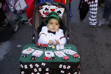 A young child takes part in the Hoboken Ragamuffin Parade to celebrate Halloween in Hoboken, New Jersey 