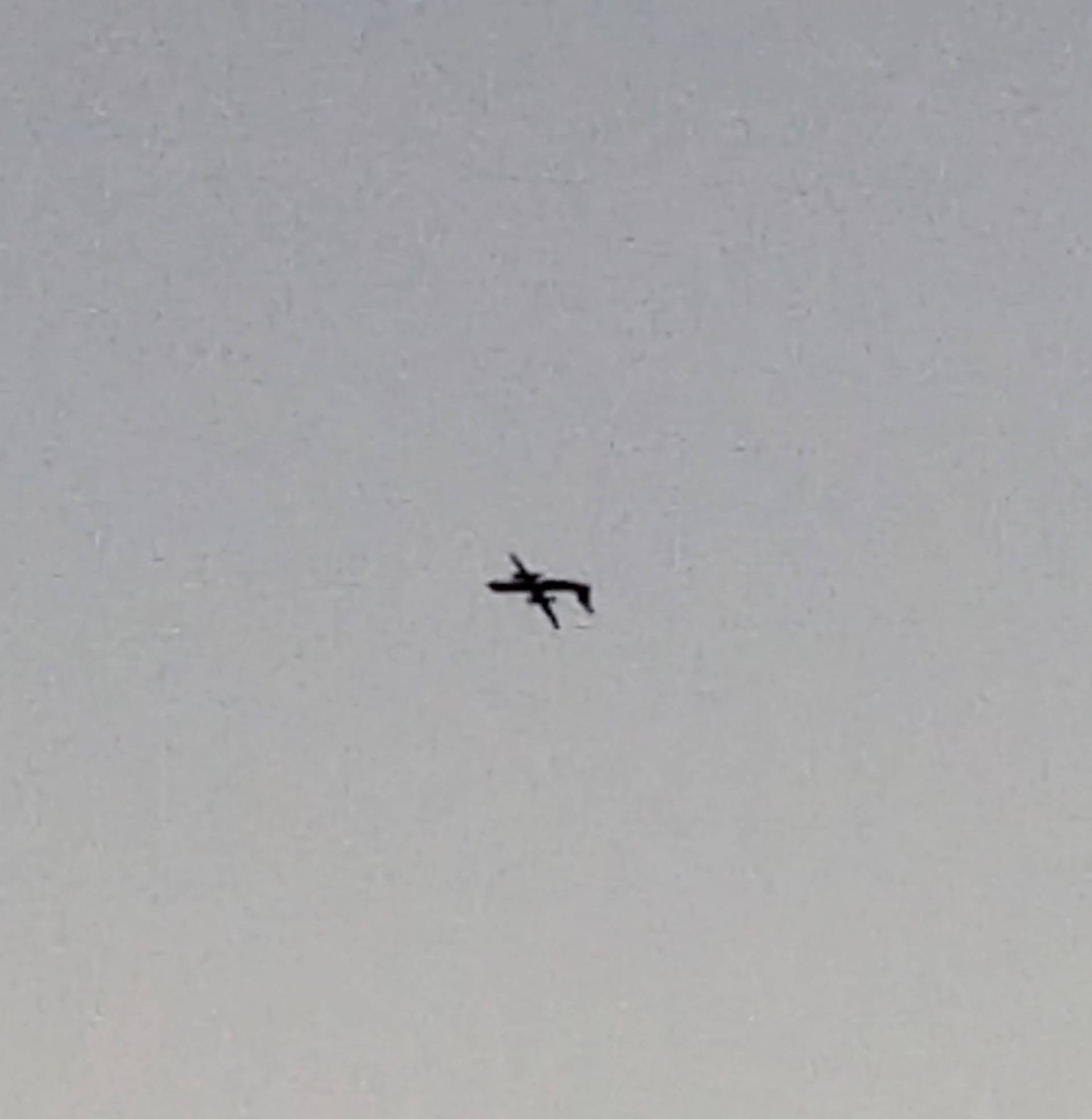 A Horizon Air Bombardier Dash 8 Q400, reported to be hijacked, flies upside down over University Place in this still image taken from a video obtained from social media