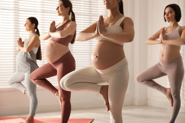 Group,Of,Pregnant,Women,Practicing,Yoga,In,Gym,,Closeup