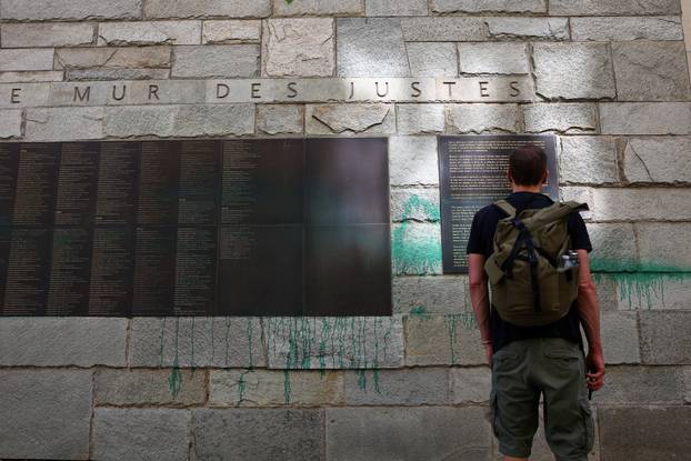 The Wall of the Righteous covered in green paint, in Paris