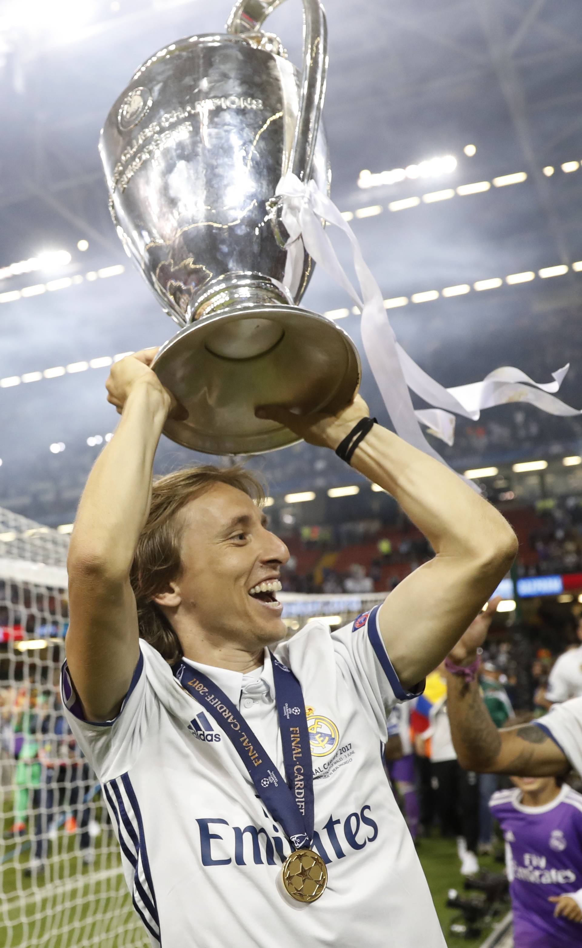 Real Madrid's Luka Modric celebrates with the trophy after winning the UEFA Champions League Final