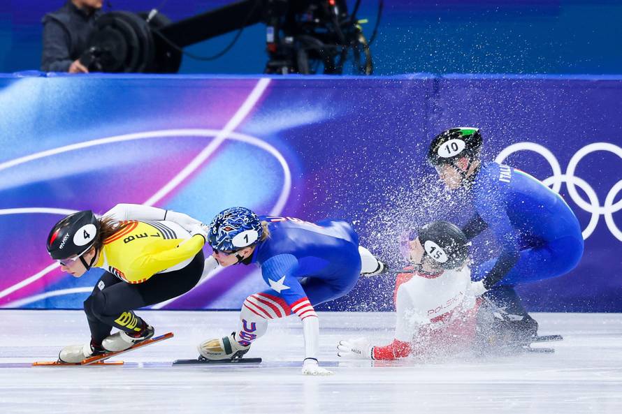 Hanne Desmet of Belgium lead while Kamila Sellier of Poland crashes with Kristen Santos-Griswold of United States of America and Arianna Fontana of Italy during the Short Track Speed Skating Women's 1500m Finals of the Milano Cortina 2026 Winter Olympics 