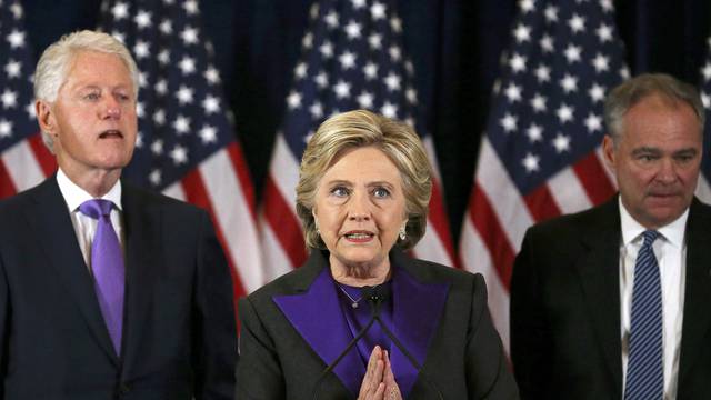 Democratic presidential candidate Hillary Clinton, husband, former U.S. President Bill Clinton, and VP nominee Kaine, listen to her concession speech in New York