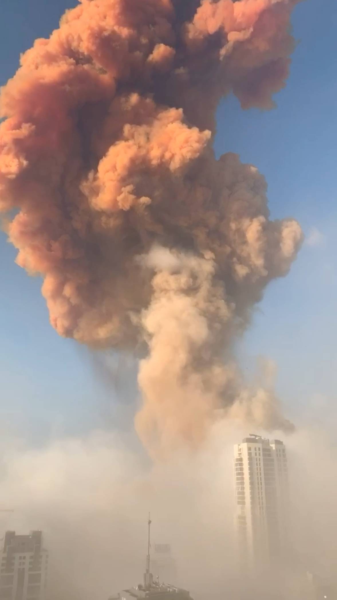 Smoke and dust from the blast is seen from atop a skyscraper in Beirut