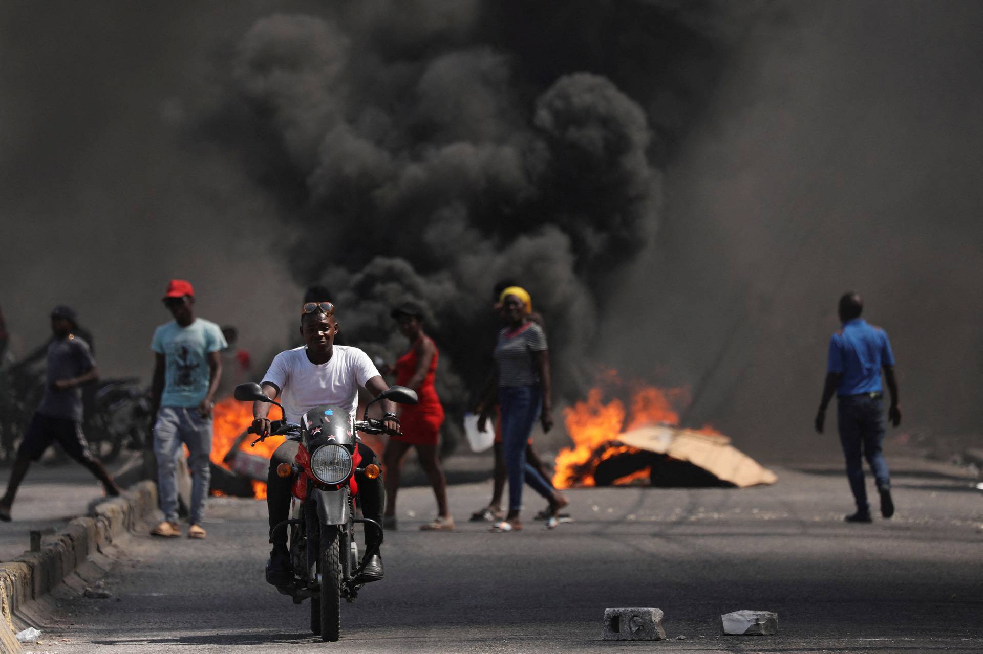 FILE PHOTO: People demonstrate against the government and insecurity in Port-au-Prince