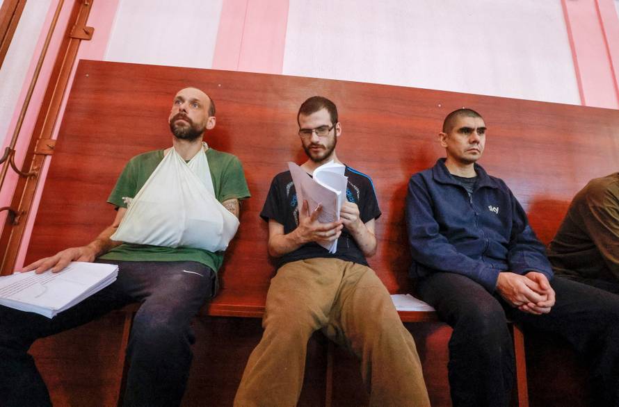 Foreign nationals captured during Ukraine-Russia conflict attend a court hearing in Donetsk
