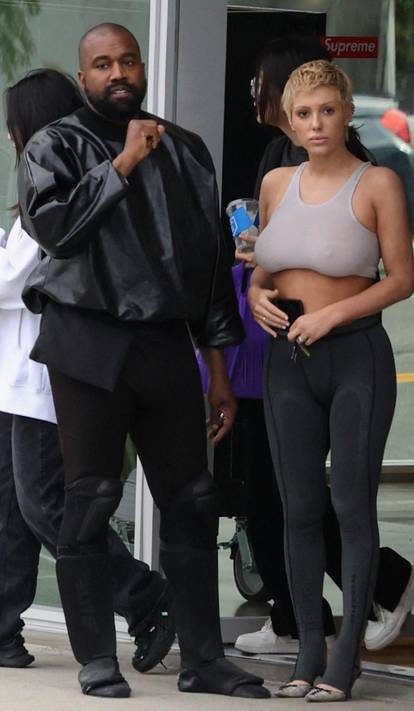 Kanye West seen in good spirits while shopping SUPREME and showing off his hummer with wife Bianca and friend