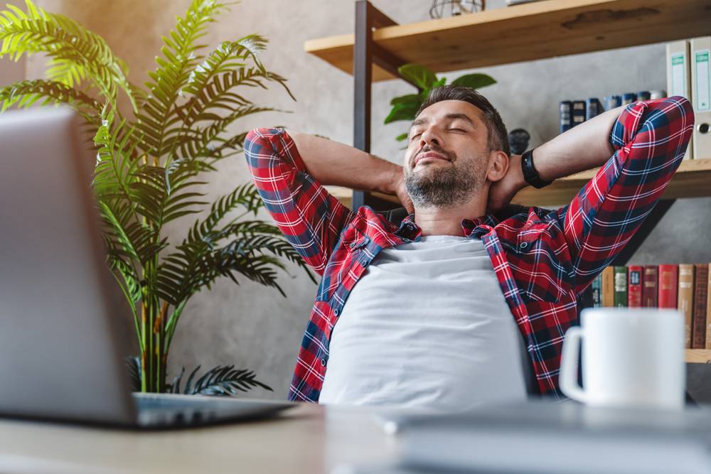 Middle,Aged,Man,Resting,In,Front,Of,Laptop,Screen,At