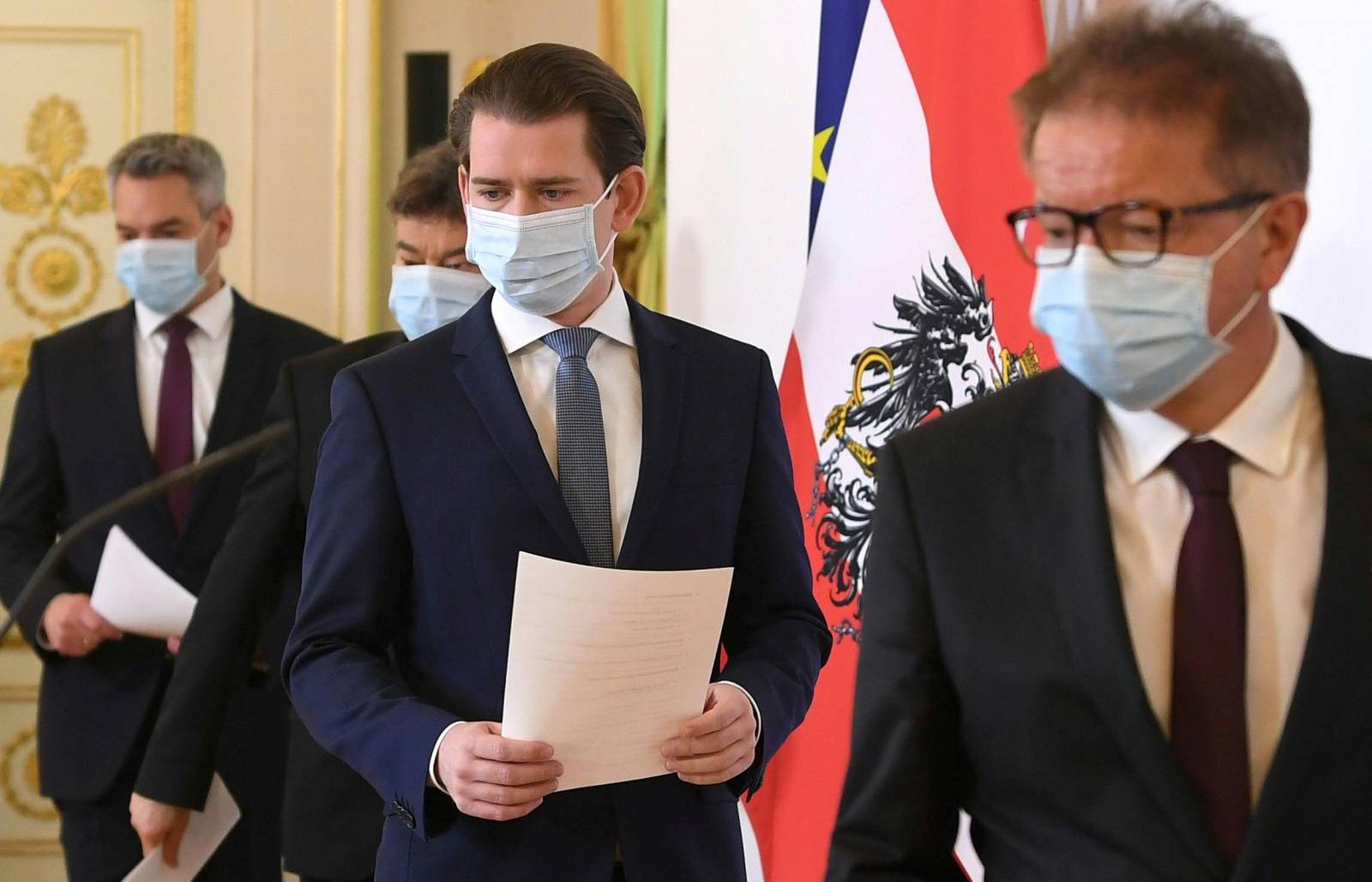 Austrian Chancellor Sebastian Kurz and Ministers arrive for a news conference in Vienna