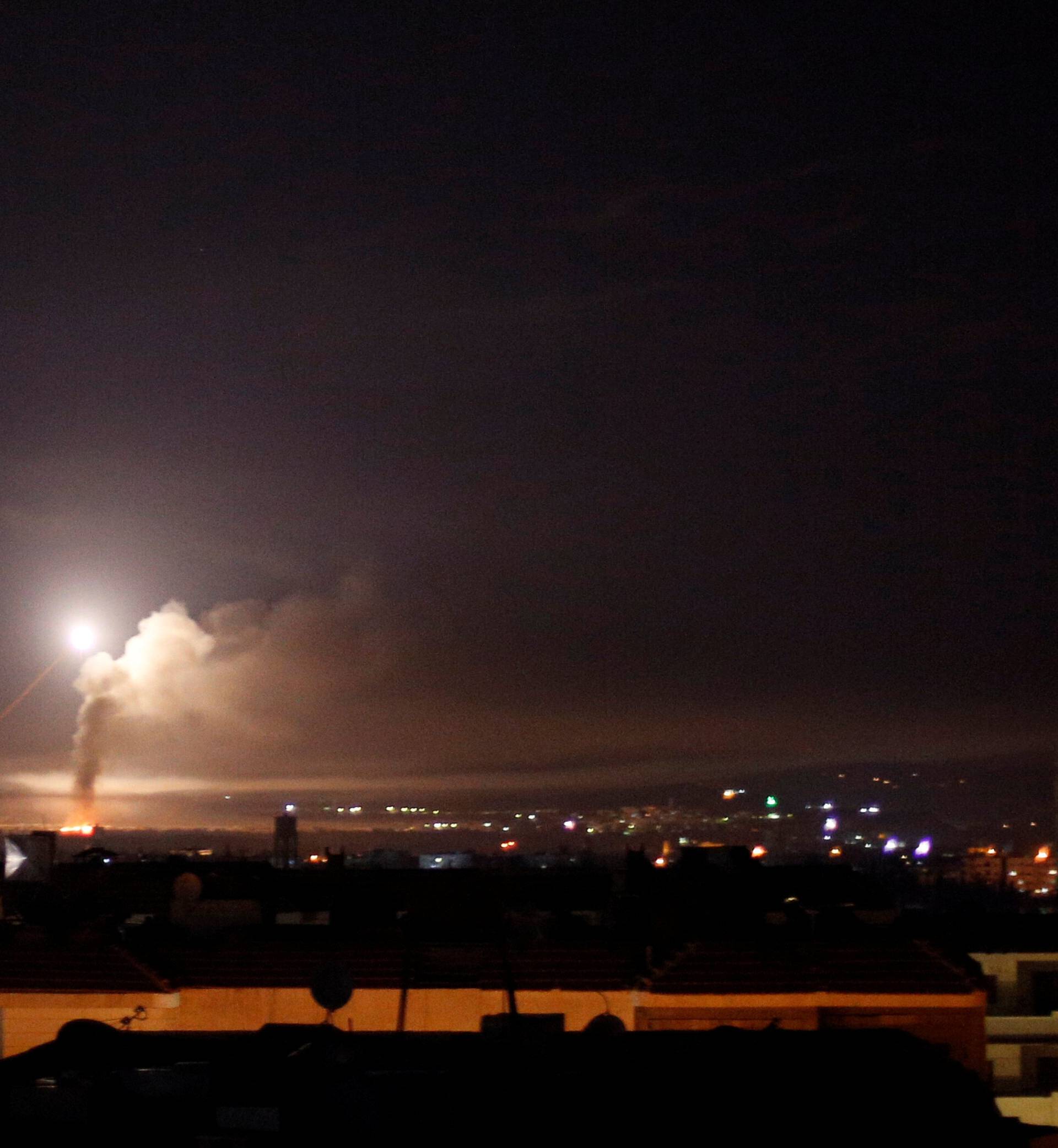 Missile fire is seen from Damascus