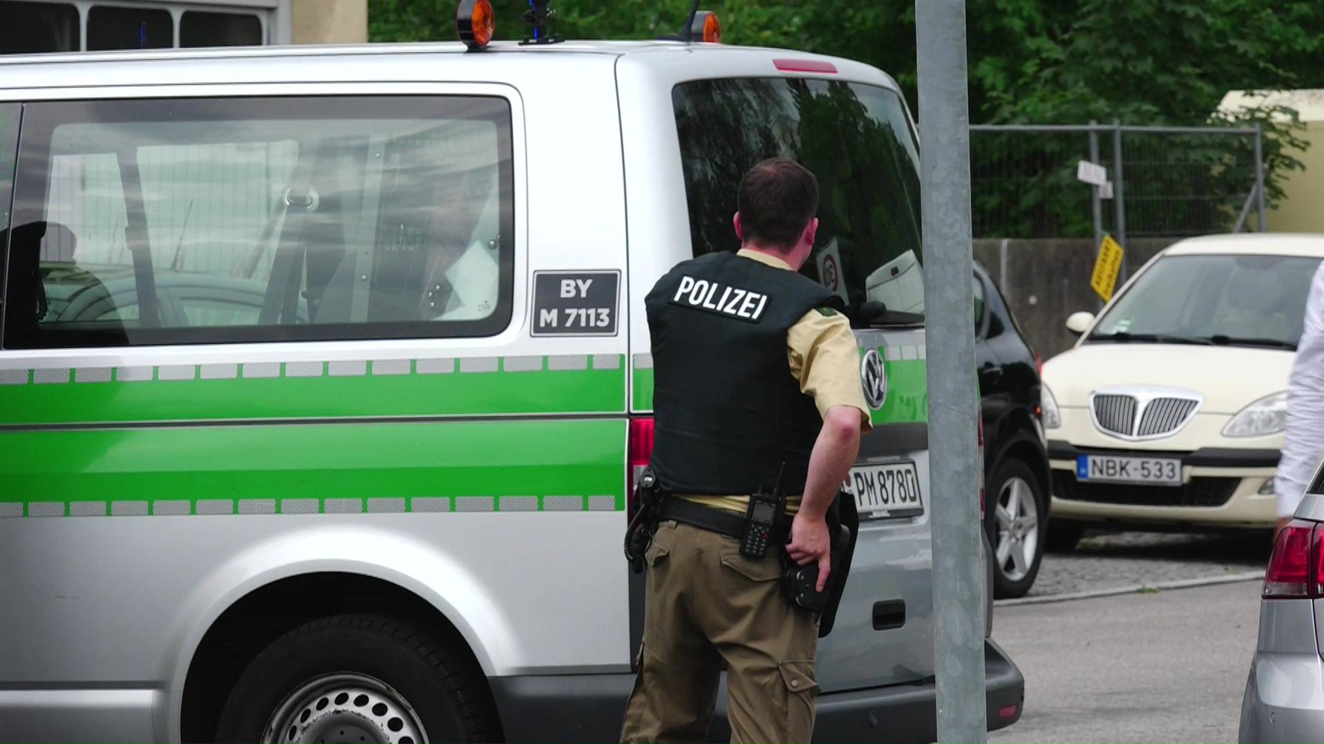 Screen grab shows police officers taking covder at scene of shooting rampage in Munich