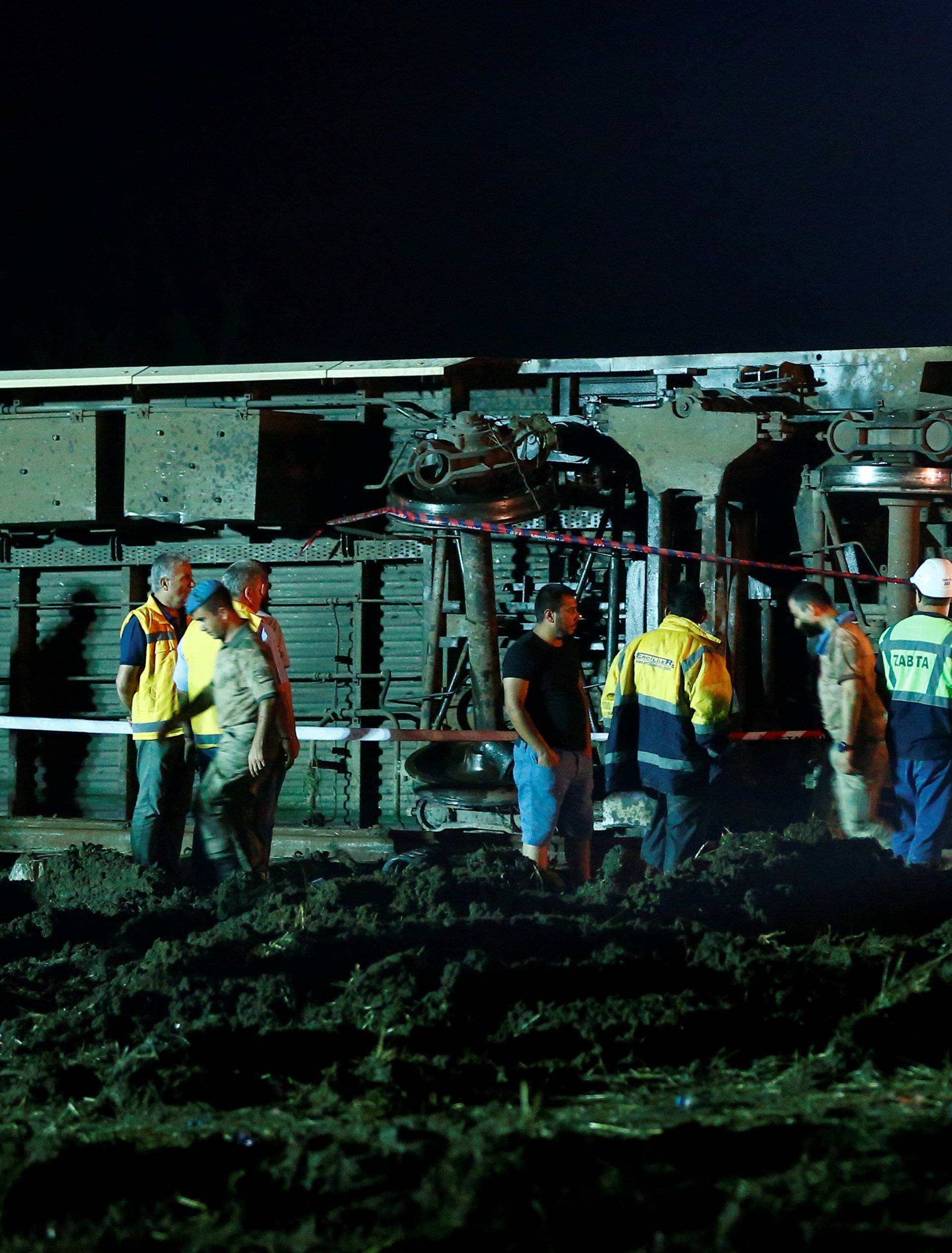 Rescue workers and paramedics work at the site of a train derailment near Corlu in Tekirdag province, Turkey