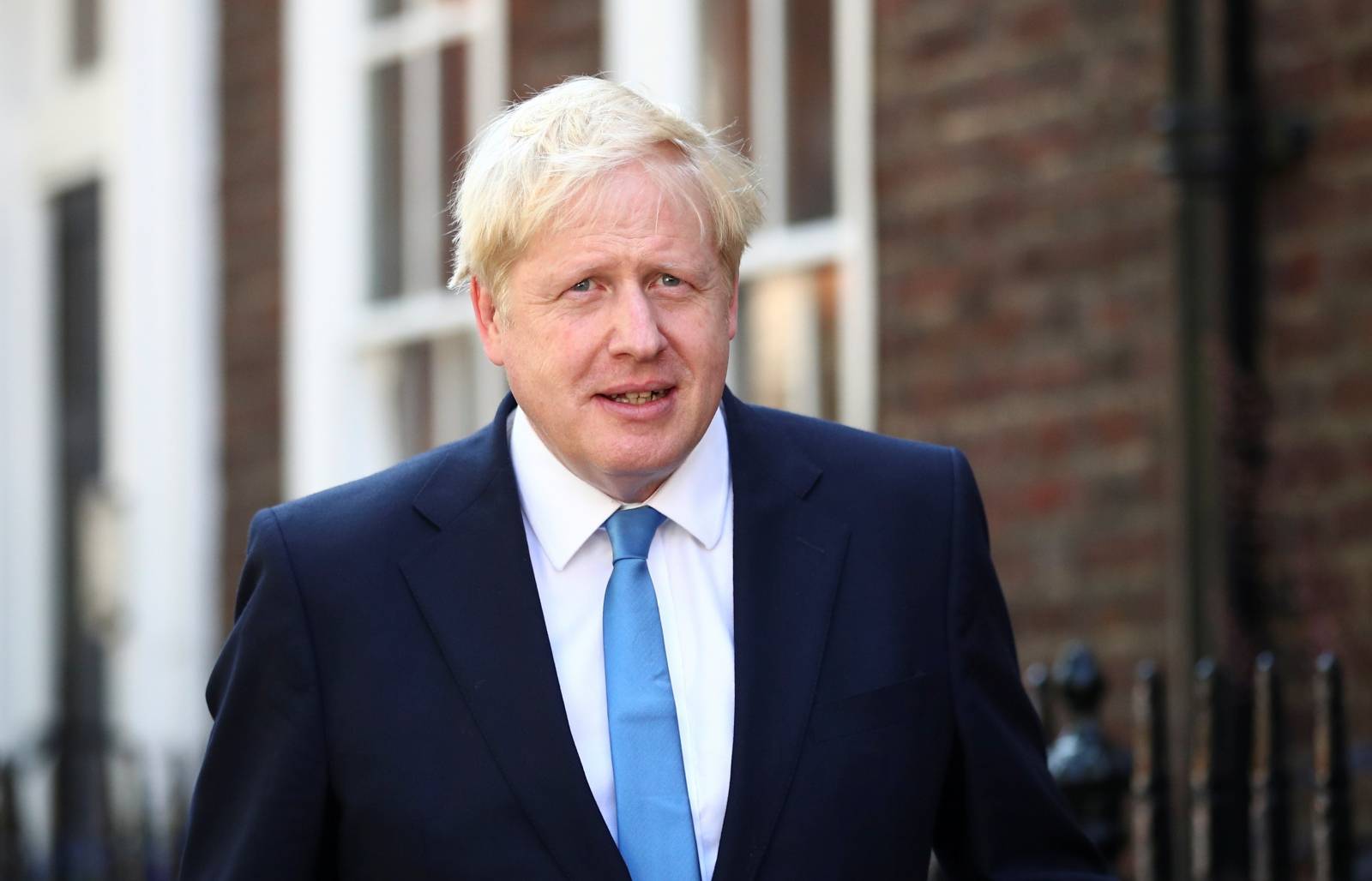 Boris Johnson is seen outside his office in London