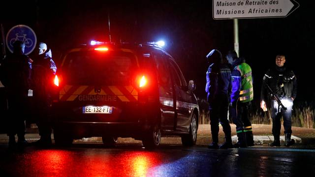 French gendarmes stand guard near a retirement home in Montferrier-sur-Lez, near Montpellier