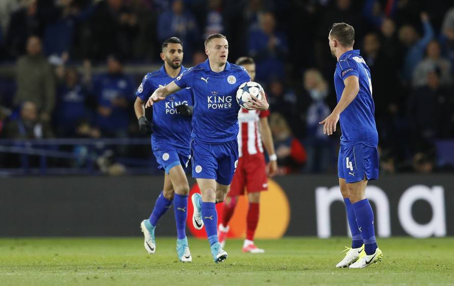 Leicester City's Jamie Vardy celebrates scoring their first goal with team mates