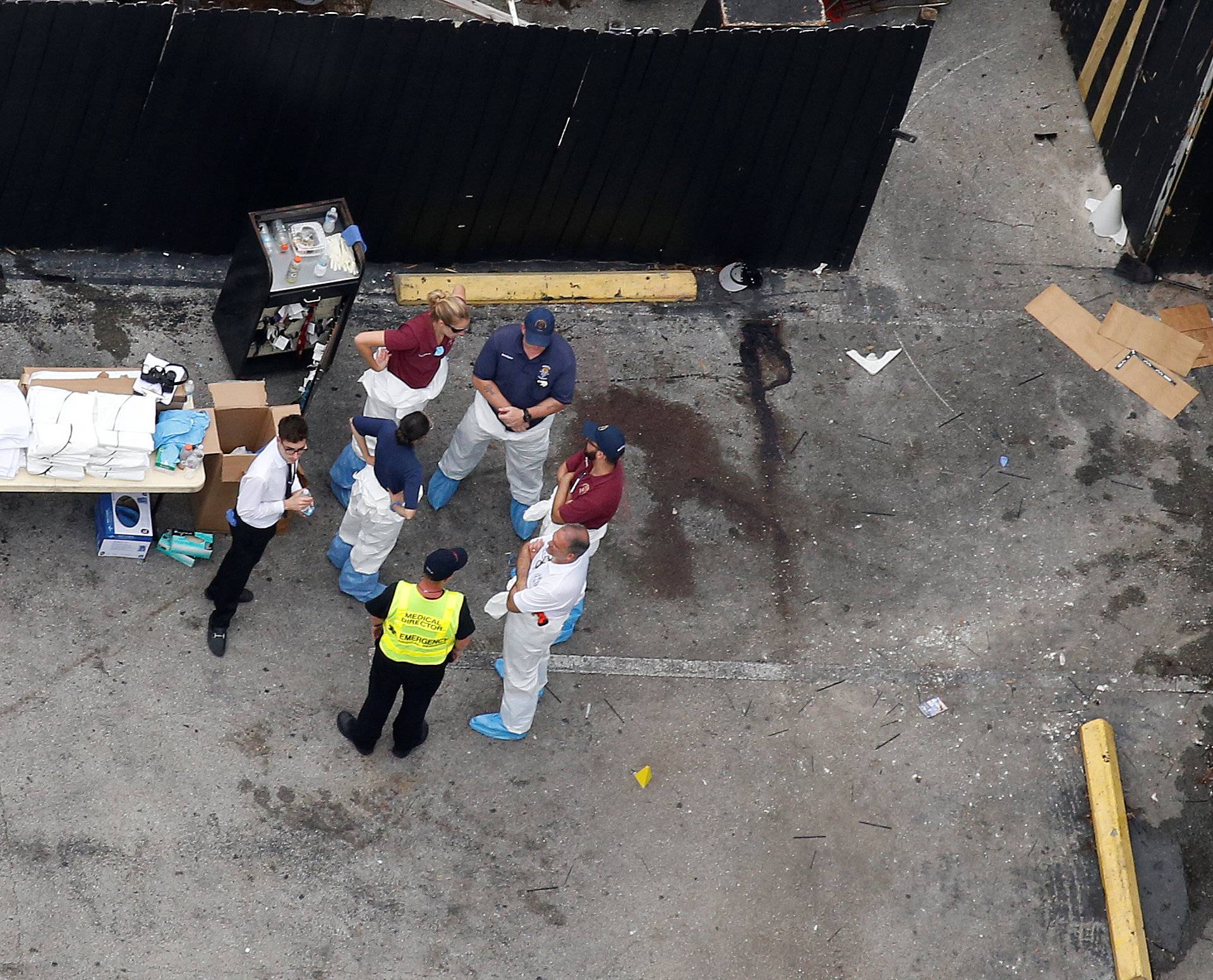 Investigators work the scene following a mass shooting at the Pulse gay nightclub in Orlando Florida