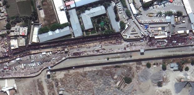 An overview of crowds along a gate of Kabul