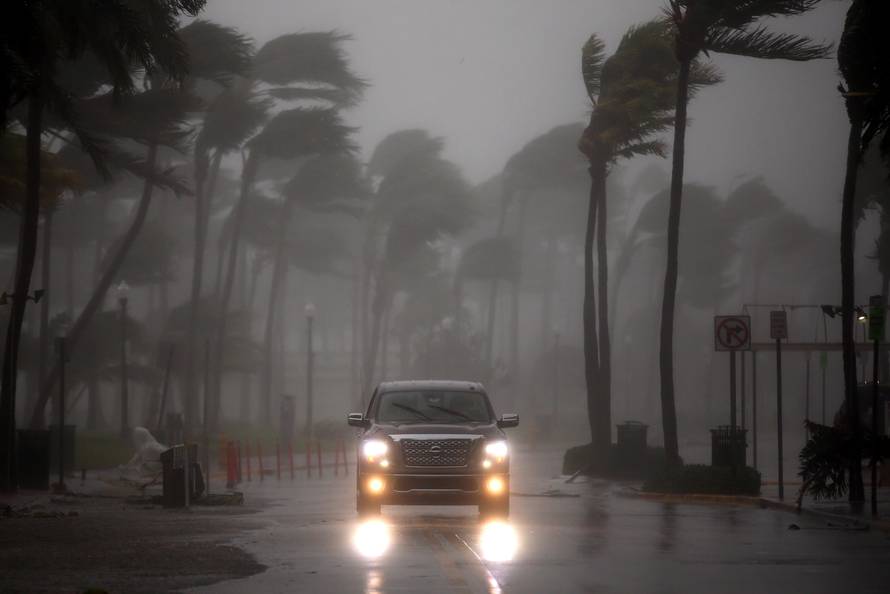 A vehicle drives along Ocean Drive in South Beach as Hurricane Irma arrives at south Florida, in Miami Beach