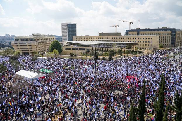 Israelis protest during a demonstration after Israeli PM Netanyahu dismissed the defense minister and his nationalist coalition government presses on with its judicial overhaul in Jerusalem