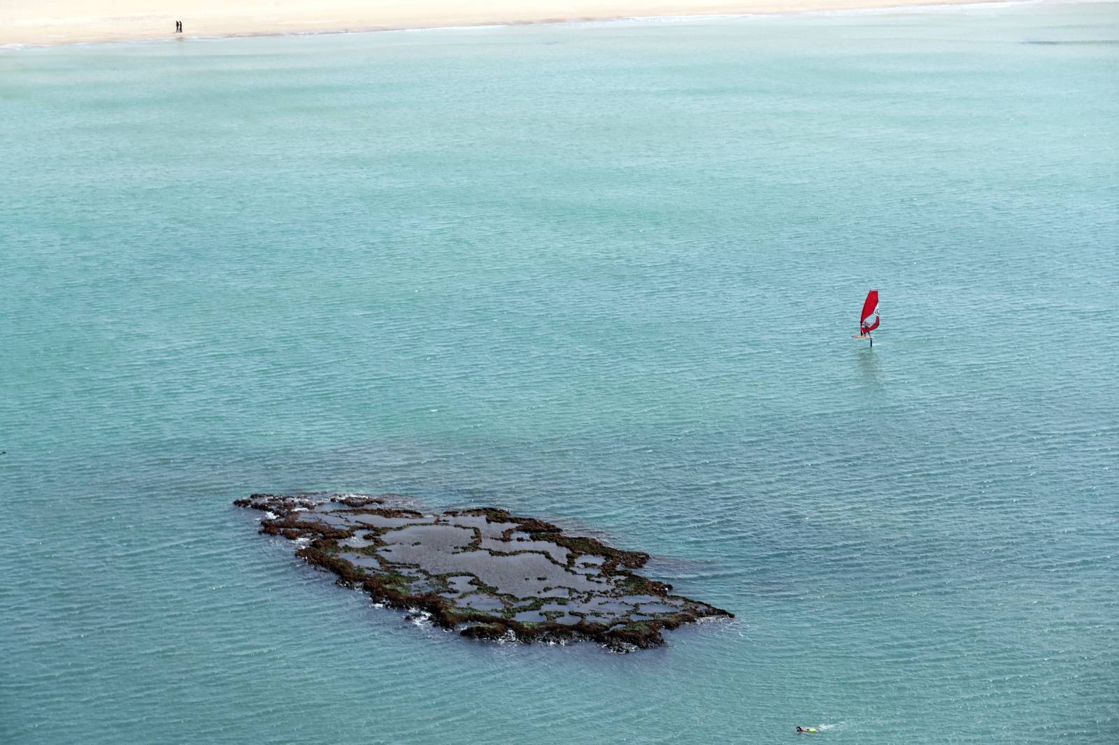 Israel's beaches blackened by tar after offshore oil spill