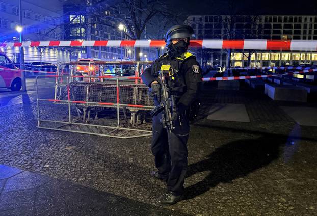 A German police officer guards Berlin’s Holocaust Memorial following a stabbing
