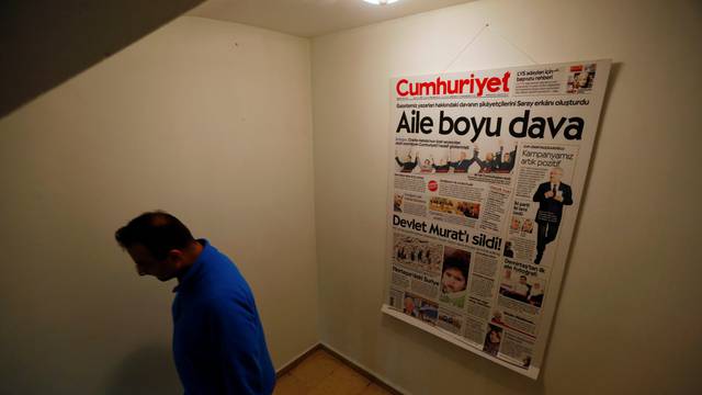 An employee of Cumhuriyet walks down at the headquarters in Istanbul