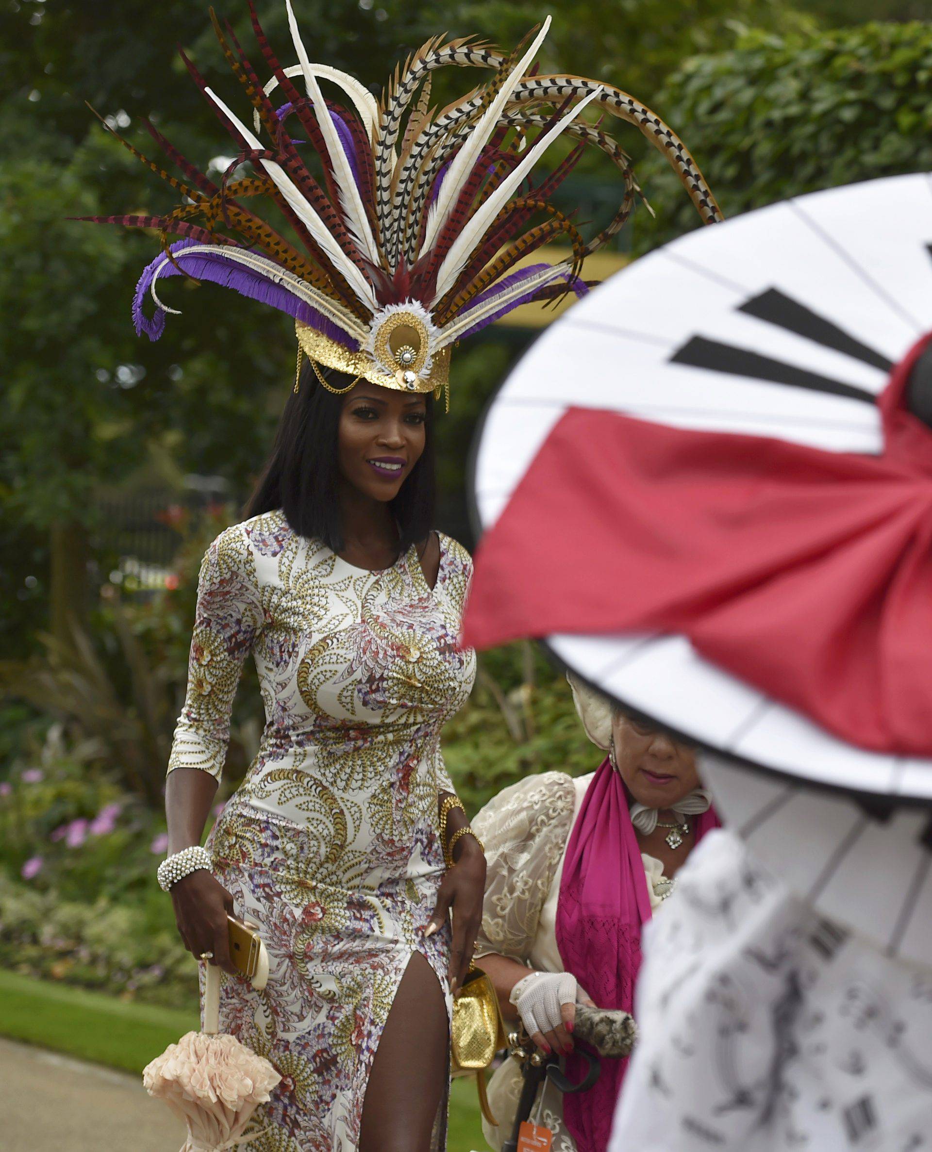 Britain Horse Racing Ladies Day Racegoers wear hats