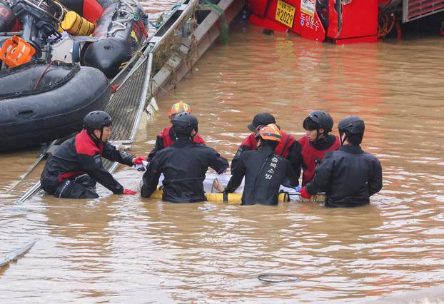 Search and rescue operation at an underpass that has been submerged by a flooded river caused by torrential rain in Cheongju