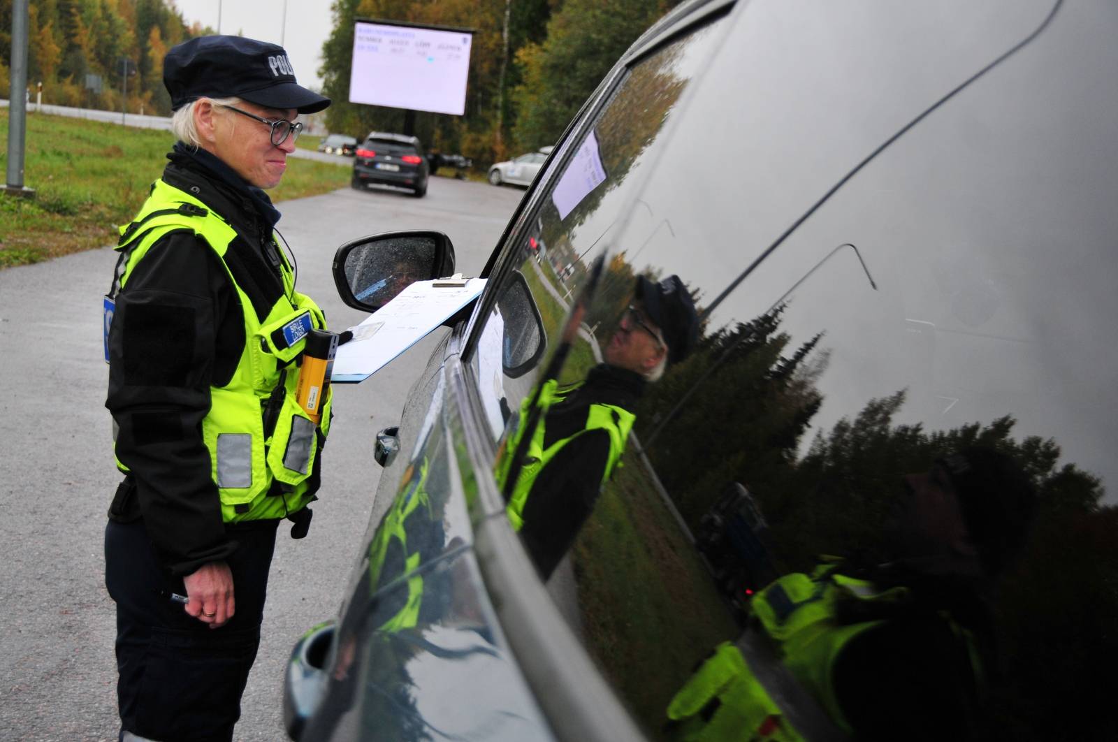 An Estonian police officer speaks to overspeeding driver near Tallinn,