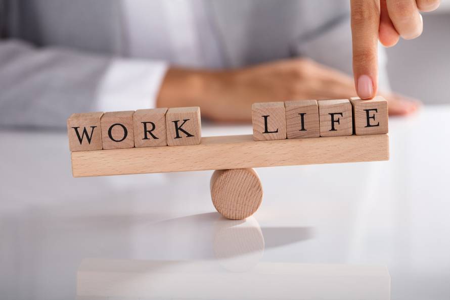 Close-up,Of,Businessperson's,Finger,Showing,Imbalance,Between,Work,And,Life