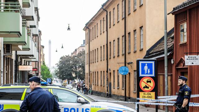 Truck driver is on the run after crashing into taxi, in the Sodermalm district, in Stockholm