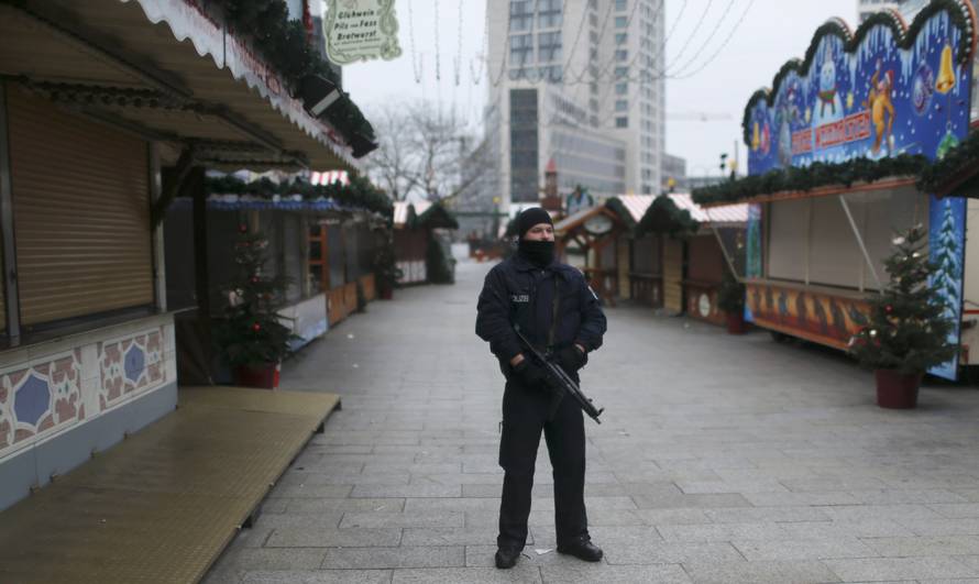 Police stands guard at the Kaiser-Wilhelm-Gedaechtniskirche Christmas market in Berlin