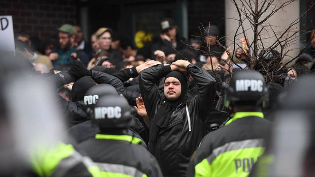 Protesters are surrounded by police during protest near the inauguration of President-elect Donald Trump in Washington