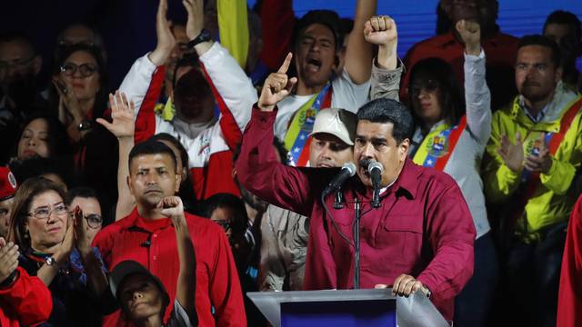 Venezuela's President Maduro stands with supporters after the results of the election were released in Caracas