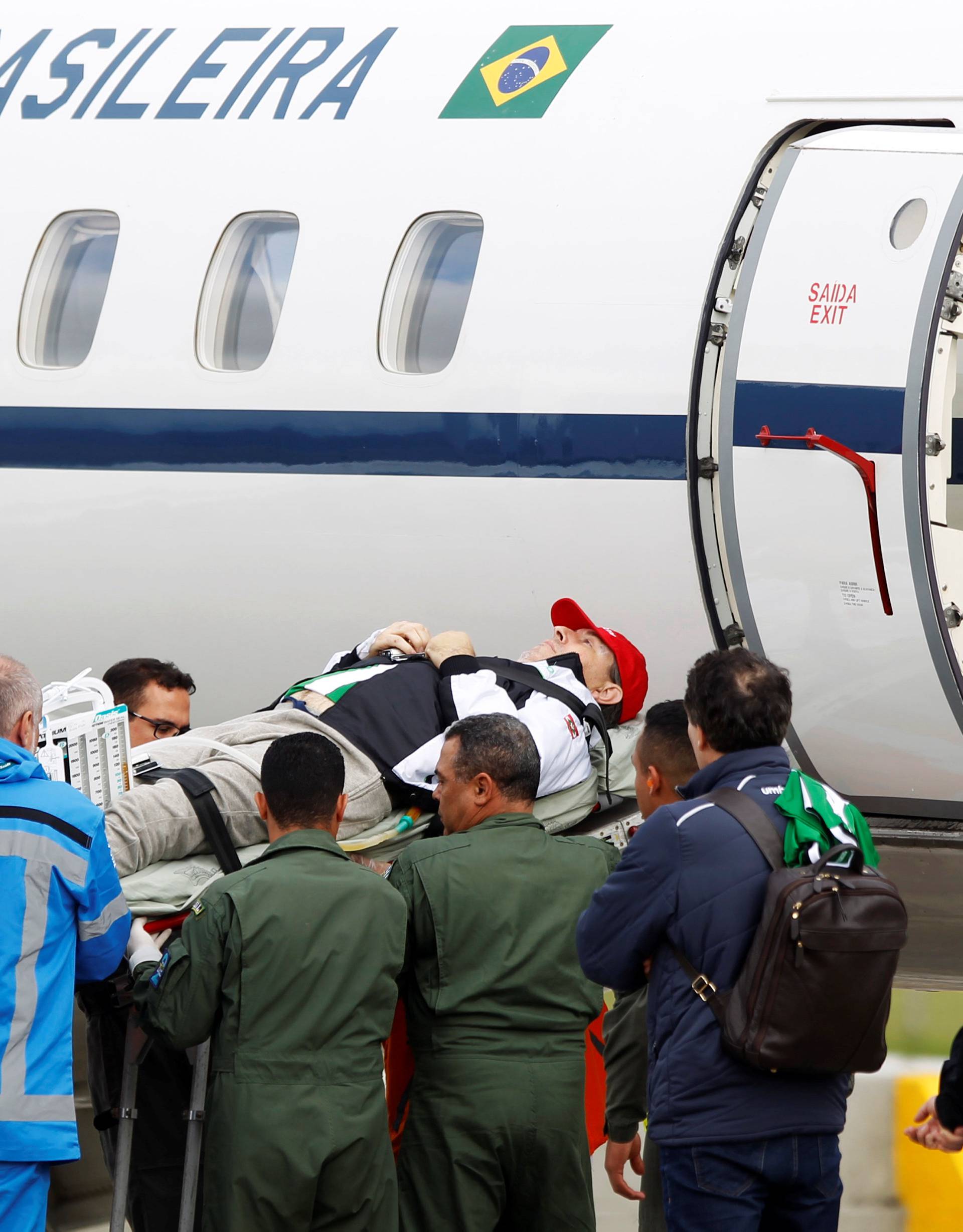 Brazilian radio journalist Rafael Henzel is being loaded into a plane of Brazilian's Air Force for his return to Brazil, after he survived a plane crash with Brazilian soccer team Chapecoense aboard, in Rionegro