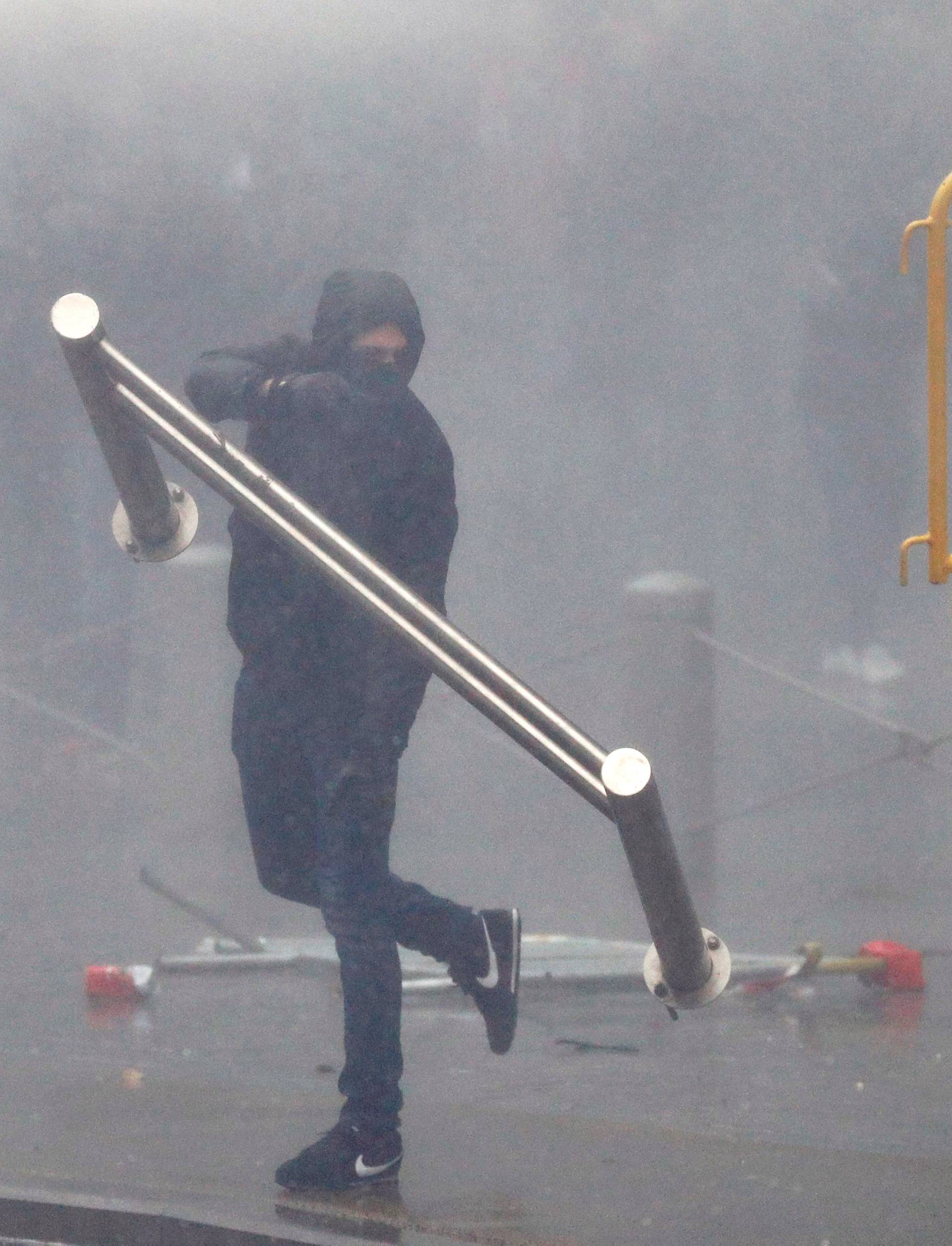 Far-right supporters throw barricades during a protest against Marrakesh Migration Pact in Brussels