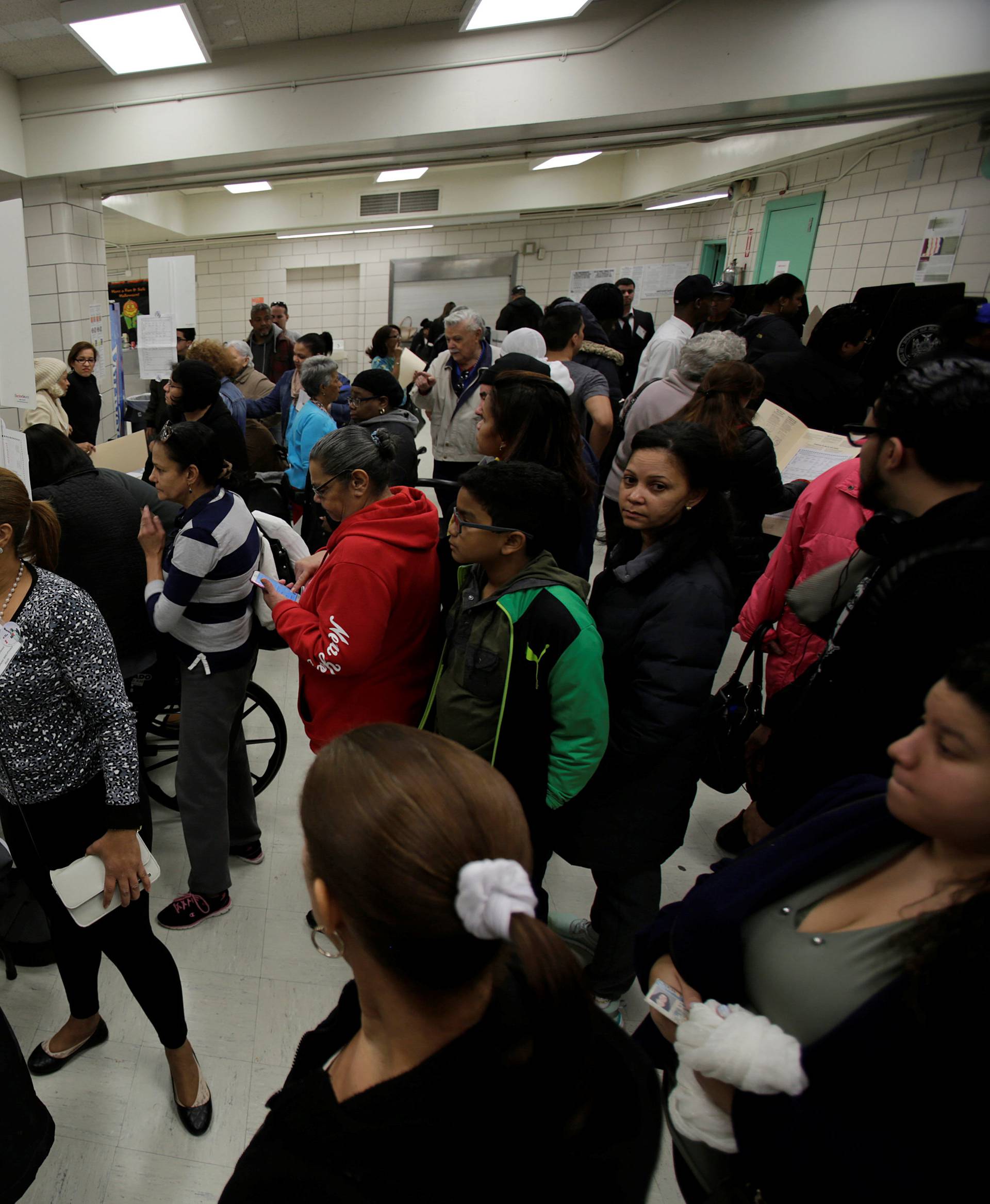 Voters register to vote during the U.S. presidential election at a polling station in the Bronx Borough of New York,