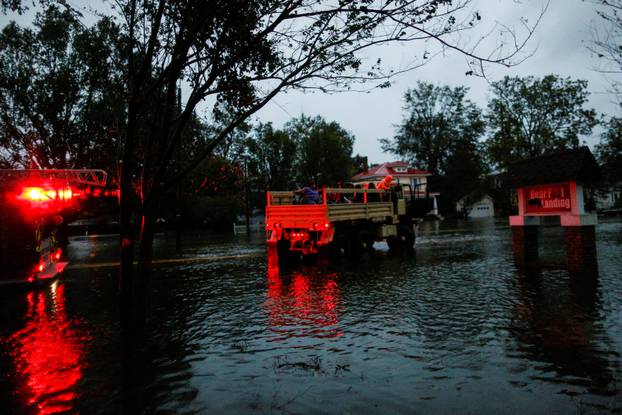 People are rescued by members of the U.S. Army during the passing of Hurricane Florence in the town of New Bern