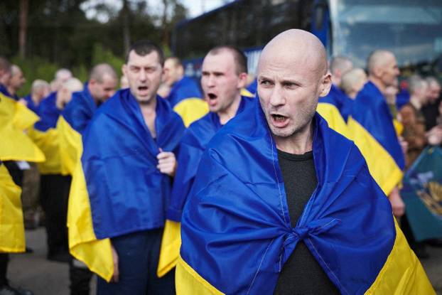 Ukrainian POWs are seen after a swap at an unknown location in Ukraine
