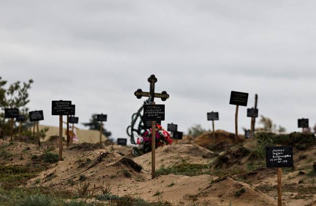 A view of graves, which Ukrainian officials say, is a civilian  mass grave, in the newly recaptured town of Lyman