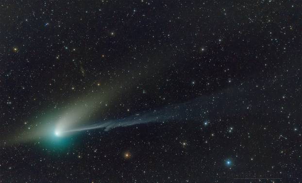 A green comet named Comet C/2022 E3 (ZTF), is seen journeying tens of millions of miles (km) away from Earth in this telescope image