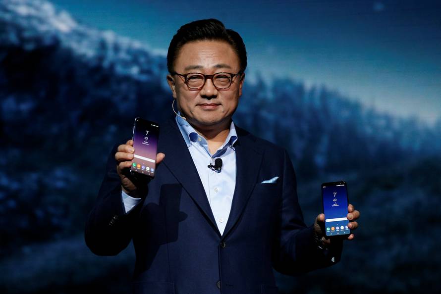DJ Koh, Samsung president of mobile Communications, shows the Galaxy S8 and S8 + smartphones during the Samsung Unpacked event in New York