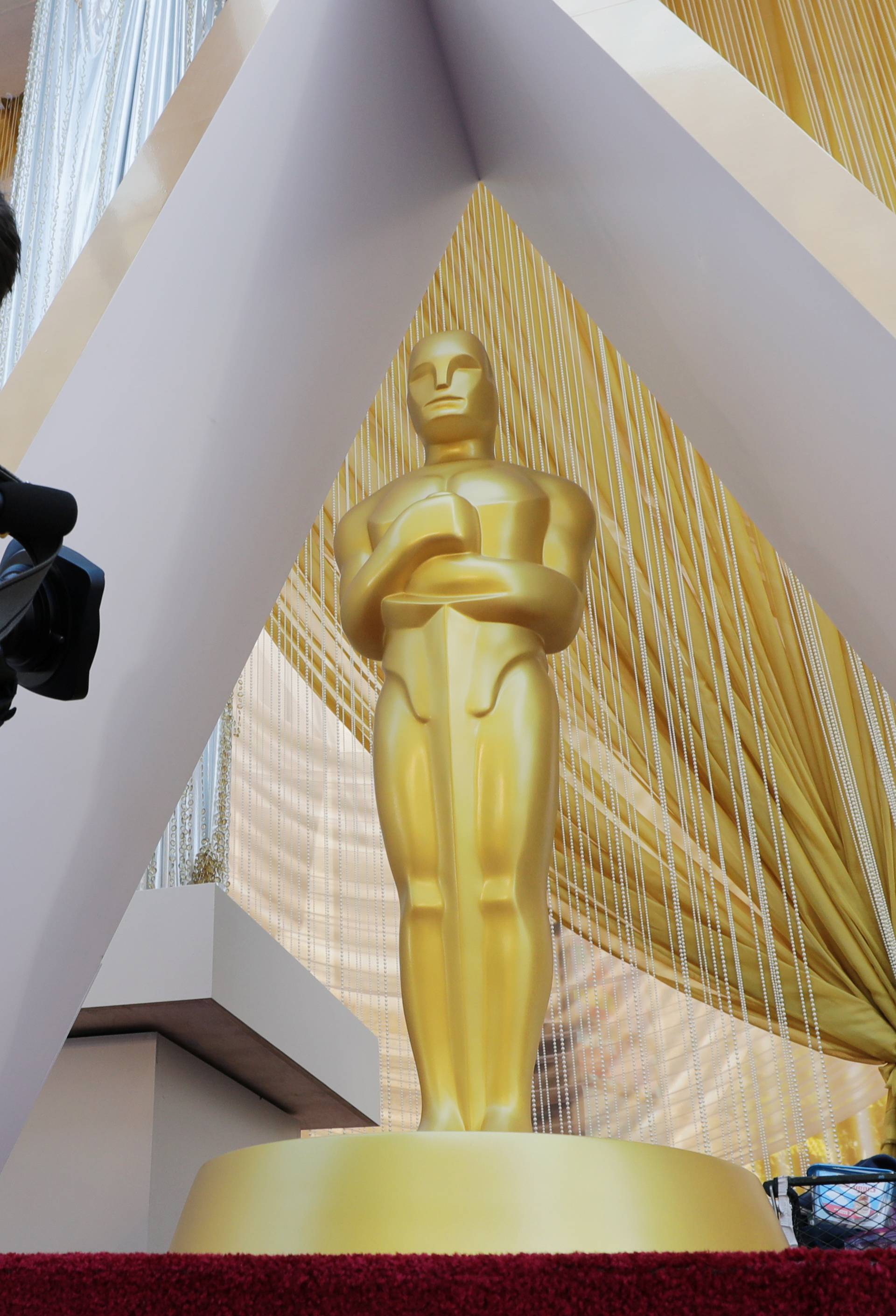 A cameraman films an Oscar statue on the red carpet as Oscars preparations continue for the 92nd Academy Awards in Hollywood