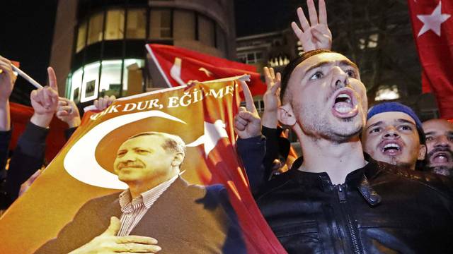 Demonstrators gather outside the Turkish consulate in Rotterdam