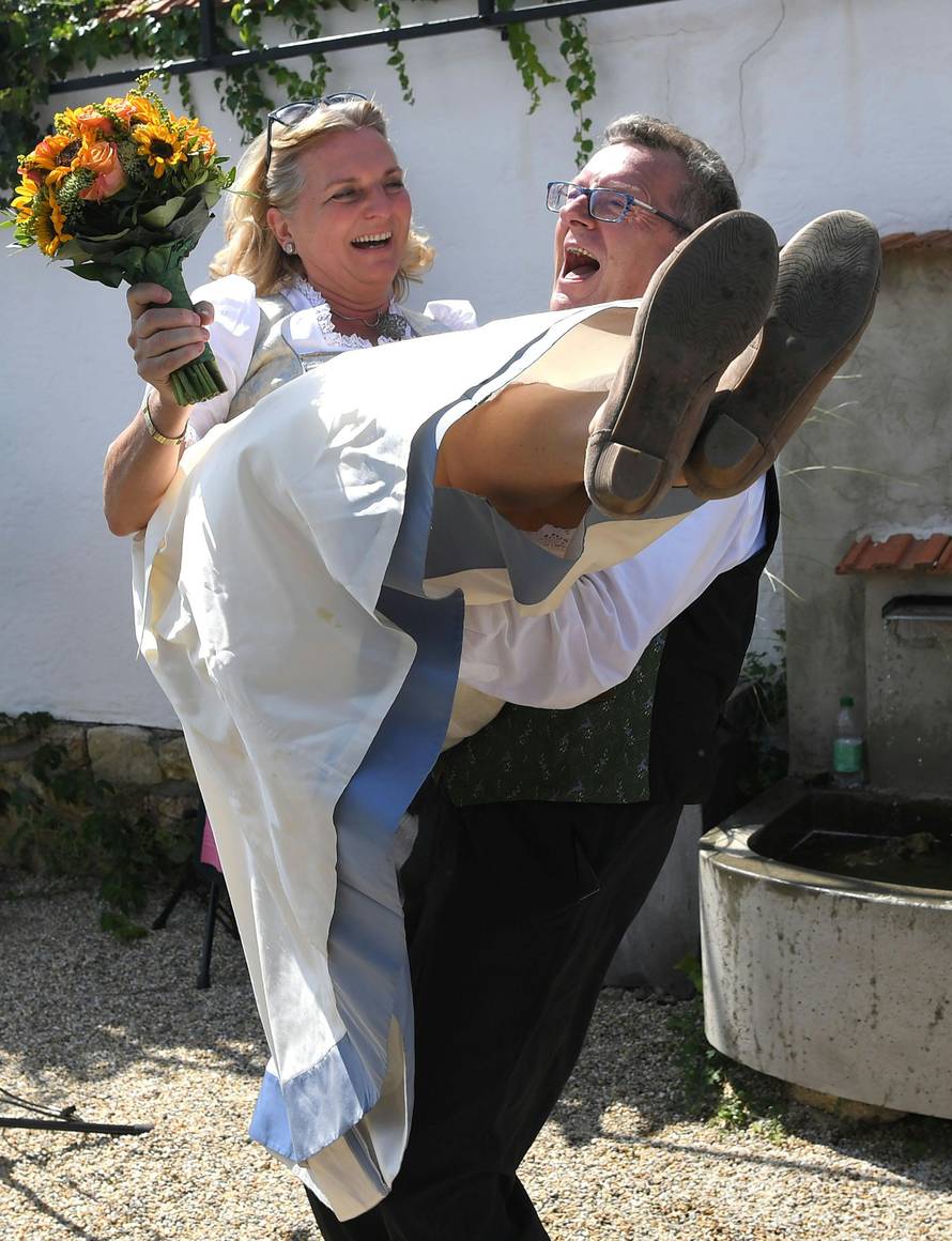 Austria's Foreign Minister Kneissl and her groom Meilinger celebrate their wedding in Gamlitz