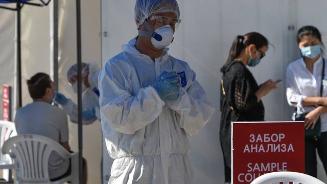 Medical specialists work at the coronavirus disease (COVID-19) testing facility in Almaty