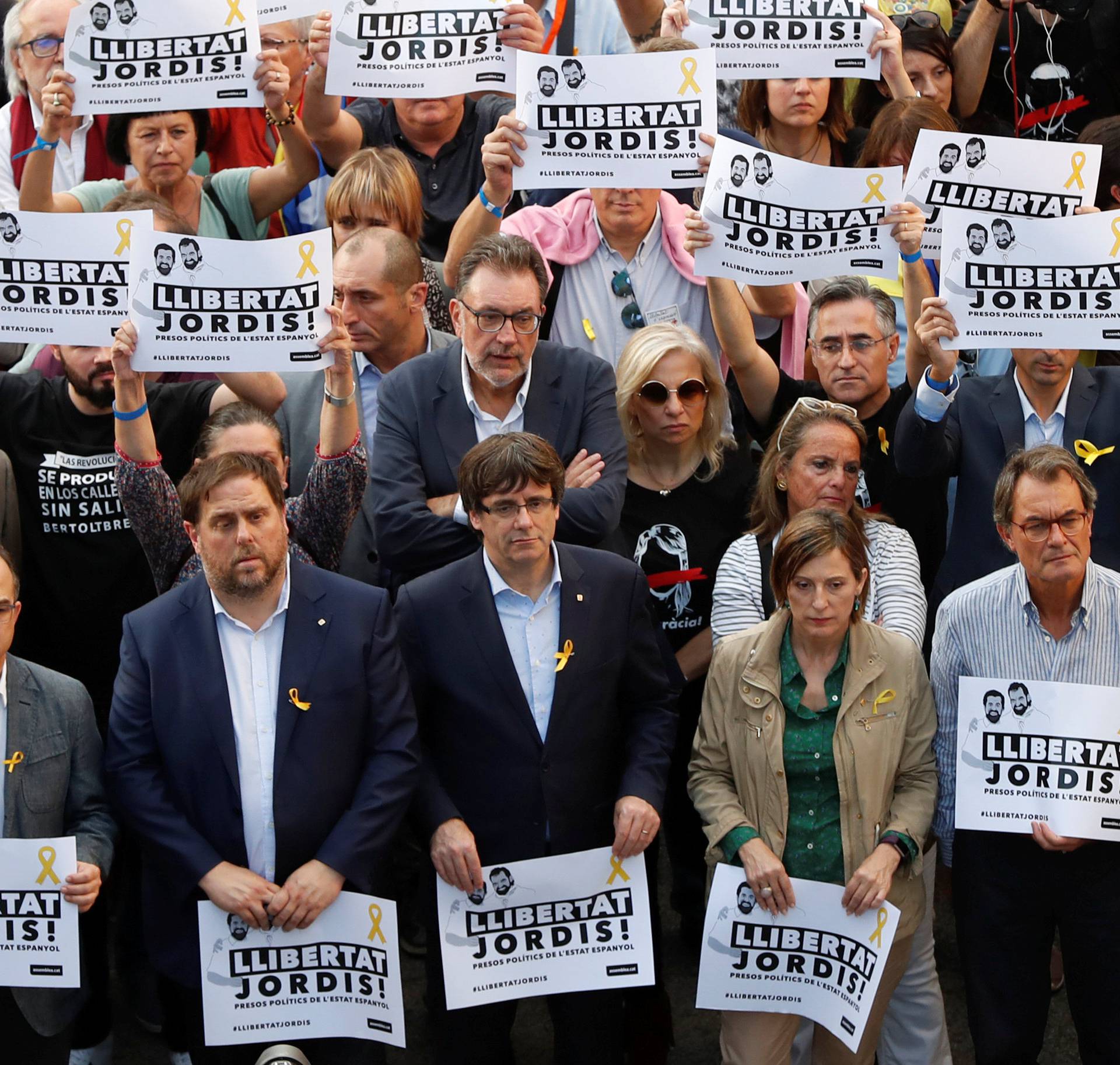 Catalan President Puigdemont and other government members attend a demonstration organised by Catalan pro-independence movements ANC (Catalan National Assembly) and Omnium Cutural, following the imprisonment of their two leaders in Barcelona